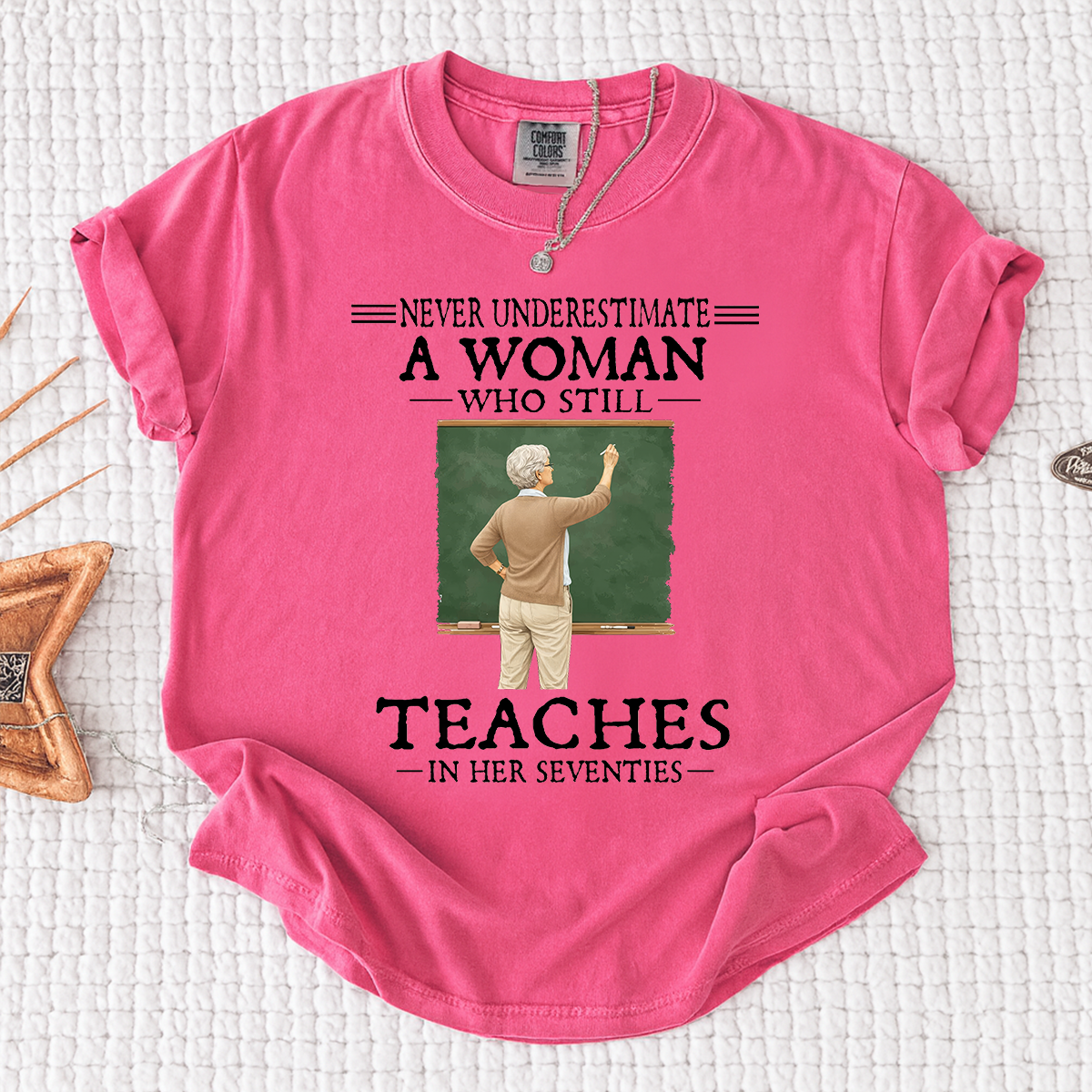 Comfort Colors Never Underestimate A Woman Who Still Teaches in Her Seventies T-Shirt – Custom Gift for Teachers