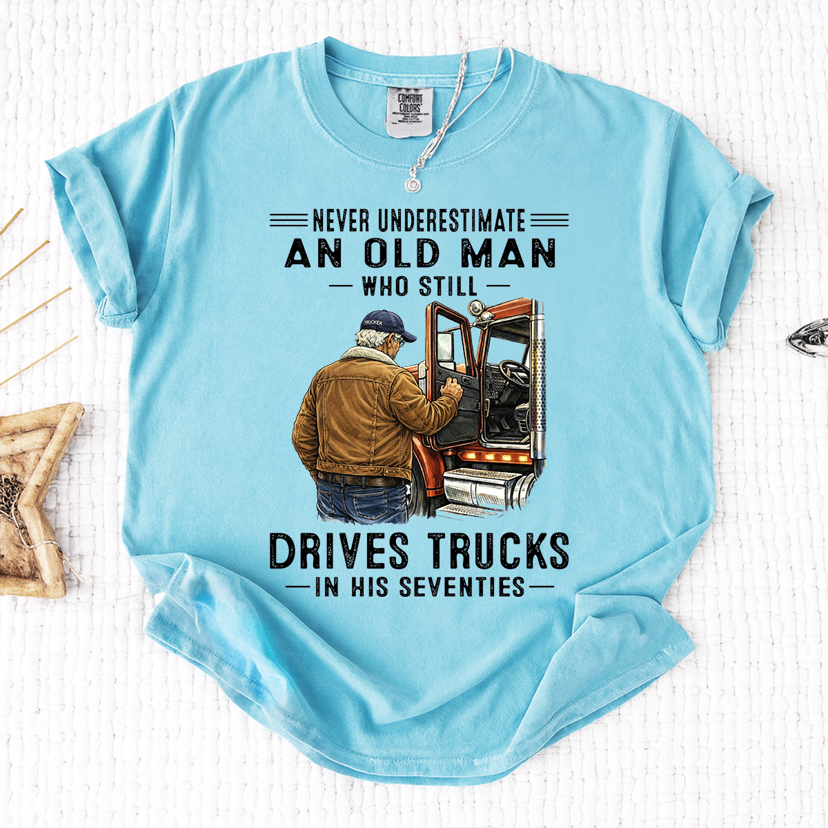 Comfort Colors Never Underestimate An Old Man Who Still Drives Trucks T-Shirt – Custom Gift for Truck Drivers in Their Seventies