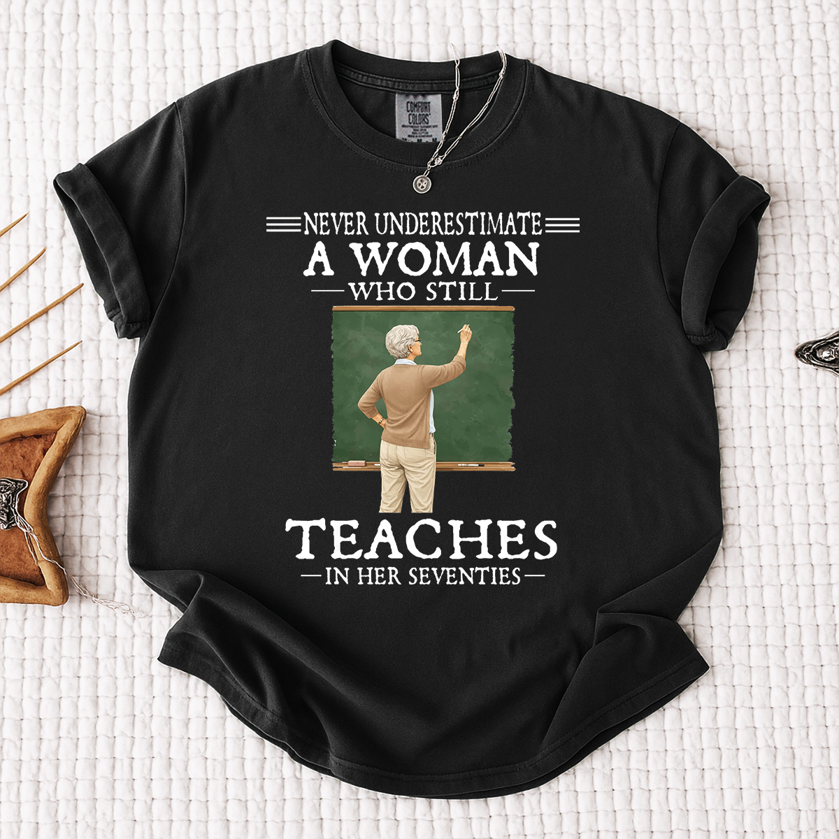 Comfort Colors Never Underestimate A Woman Who Still Teaches in Her Seventies T-Shirt – Custom Gift for Teachers