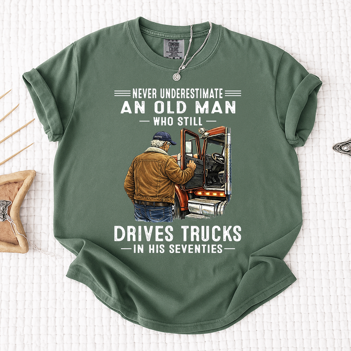 Comfort Colors Never Underestimate An Old Man Who Still Drives Trucks T-Shirt – Custom Gift for Truck Drivers in Their Seventies