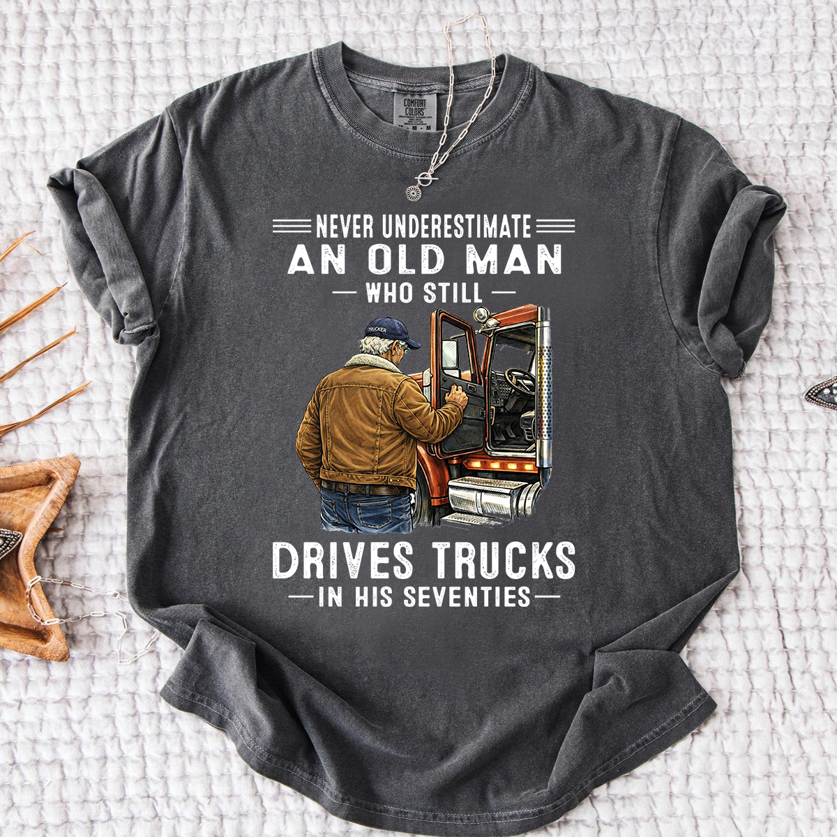 Comfort Colors Never Underestimate An Old Man Who Still Drives Trucks T-Shirt – Custom Gift for Truck Drivers in Their Seventies