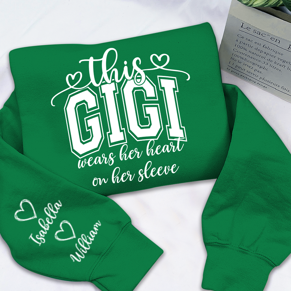Personalized Grandma Sweatshirt - This Grandma Wears Her Heart On Her Sleeve, Custom Grandkids Names on Sleeve, Cozy Crewneck Sweater Gift for Grandma, Nana, Gigi, Mimi, Family Apparel