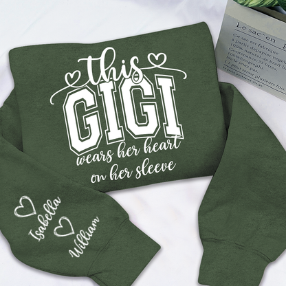 Personalized Grandma Sweatshirt - This Grandma Wears Her Heart On Her Sleeve, Custom Grandkids Names on Sleeve, Cozy Crewneck Sweater Gift for Grandma, Nana, Gigi, Mimi, Family Apparel