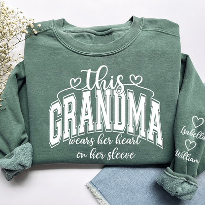 Personalized Grandma Sweatshirt, This Grandma Wears Her Heart On Her Sleeve Shirt with Grandkids’ Names, Custom Gift for Grandma Christmas