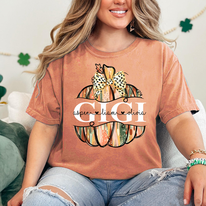 Comfort Colors® Personalized Gigi Pumpkin T-Shirt with Grandkids’ Names, Custom Fall Leopard Bow Tee for Grandma