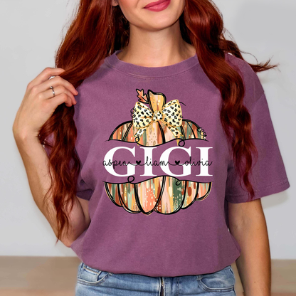 Comfort Colors® Personalized Gigi Pumpkin T-Shirt with Grandkids’ Names, Custom Fall Leopard Bow Tee for Grandma