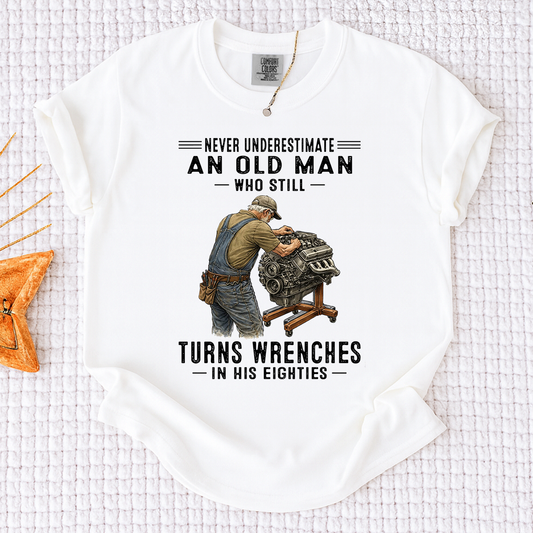 Comfort Colors Never Underestimate An Old Man Who Still Turns Wrenches T-Shirt – Custom Gift for Mechanics in Their Eighties