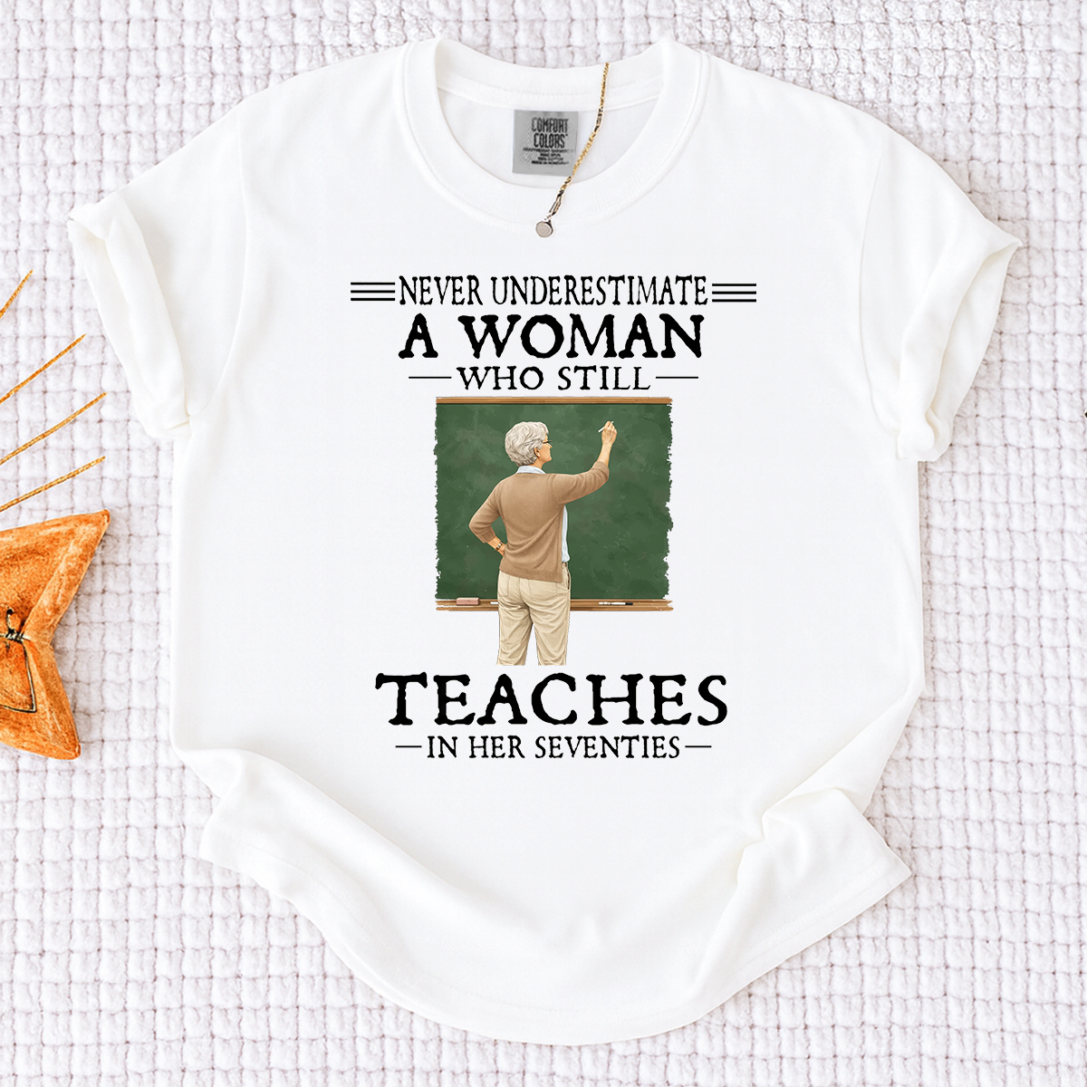 Comfort Colors Never Underestimate A Woman Who Still Teaches in Her Seventies T-Shirt – Custom Gift for Teachers