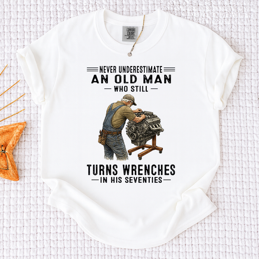 Comfort Colors Never Underestimate An Old Man Who Still Turns Wrenches in His Seventies T-Shirt – Custom Gift for Mechanics