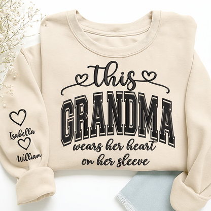 Embroidered This Grandma Wears Her Heart On Her Sleeve Shirt with Grandkids’ Names, Custom Gift for Grandma Sweatshirt