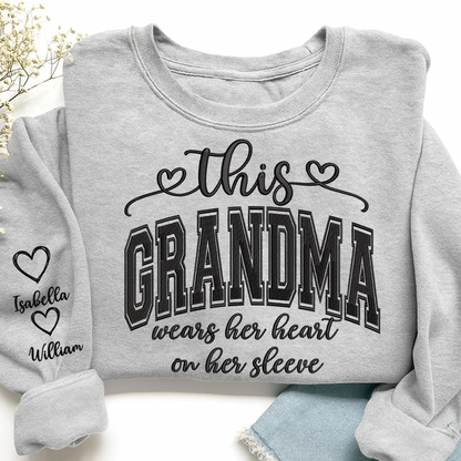 Embroidered This Grandma Wears Her Heart On Her Sleeve Shirt with Grandkids’ Names, Custom Gift for Grandma Sweatshirt