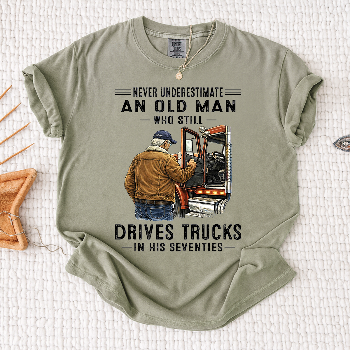 Comfort Colors Never Underestimate An Old Man Who Still Drives Trucks T-Shirt – Custom Gift for Truck Drivers in Their Seventies