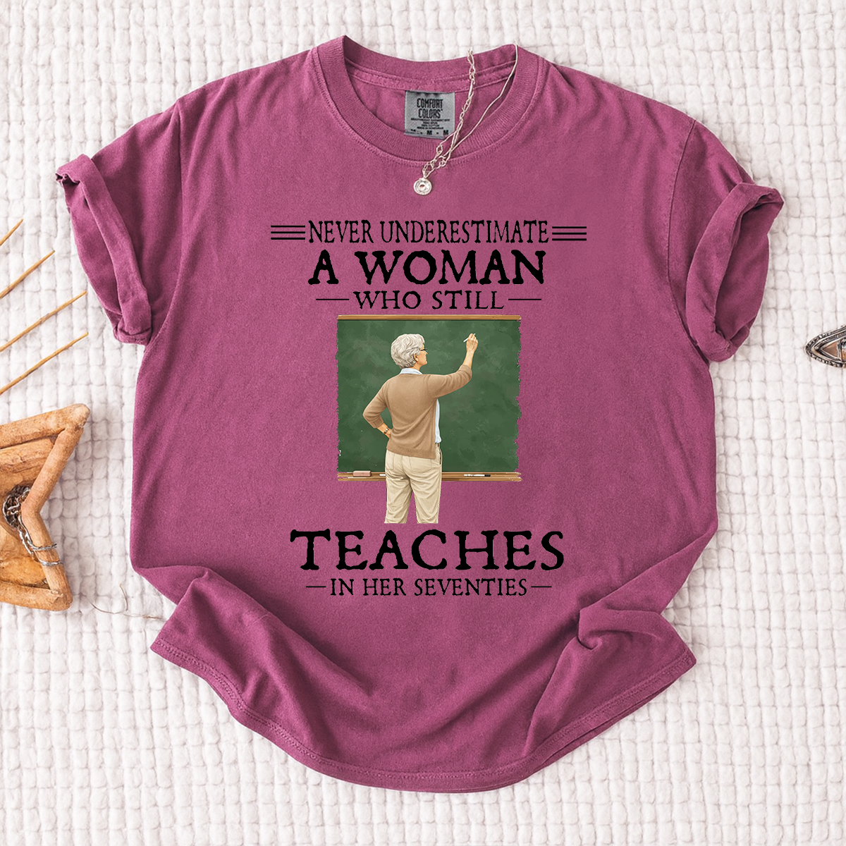 Comfort Colors Never Underestimate A Woman Who Still Teaches in Her Seventies T-Shirt – Custom Gift for Teachers