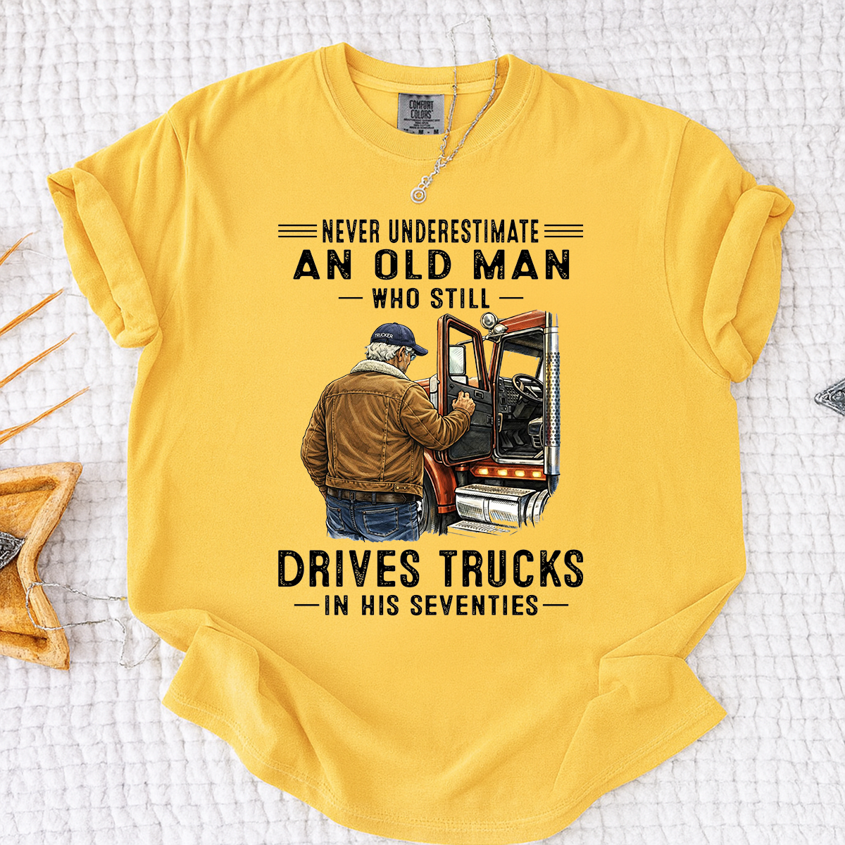 Comfort Colors Never Underestimate An Old Man Who Still Drives Trucks T-Shirt – Custom Gift for Truck Drivers in Their Seventies