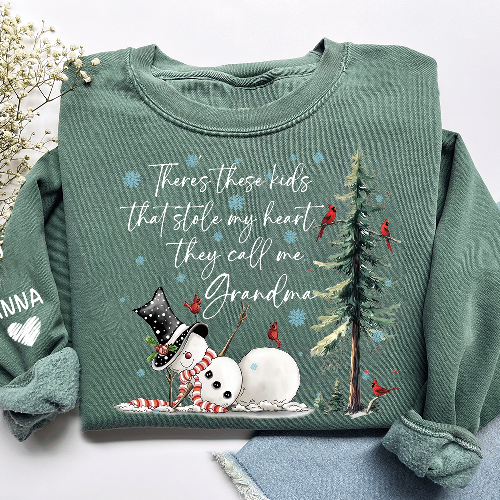 There’s These Kids That Stole My Heart They Call Me Grandma Sweatshirt, Personalized Christmas Shirt For Grandma And Kids