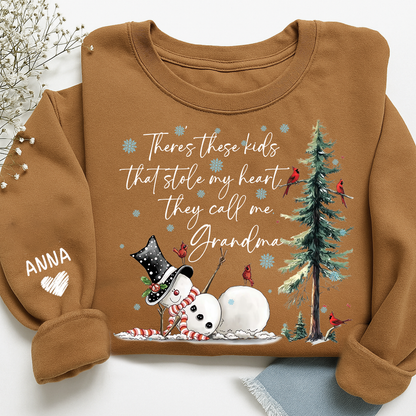 There’s These Kids That Stole My Heart They Call Me Grandma Sweatshirt, Personalized Christmas Shirt For Grandma And Kids