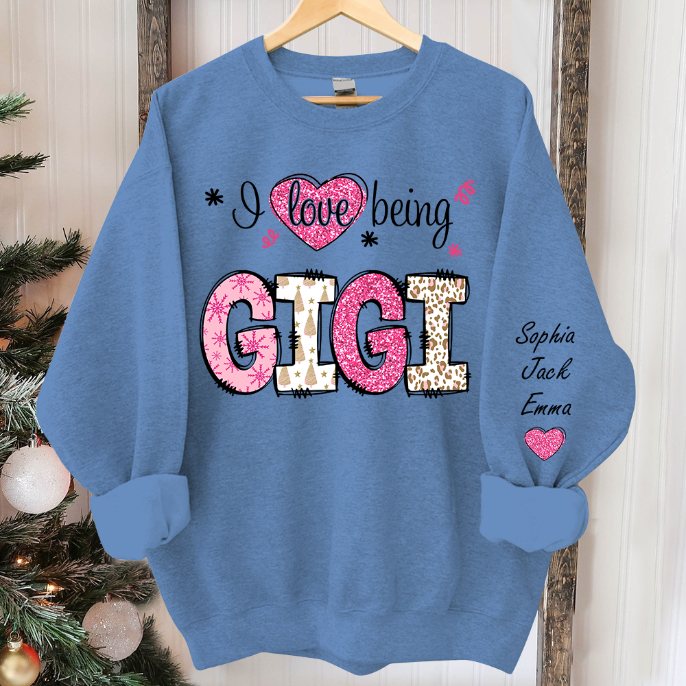 I love being Gigi Pink Christmas And Grandkids Sweatshirt