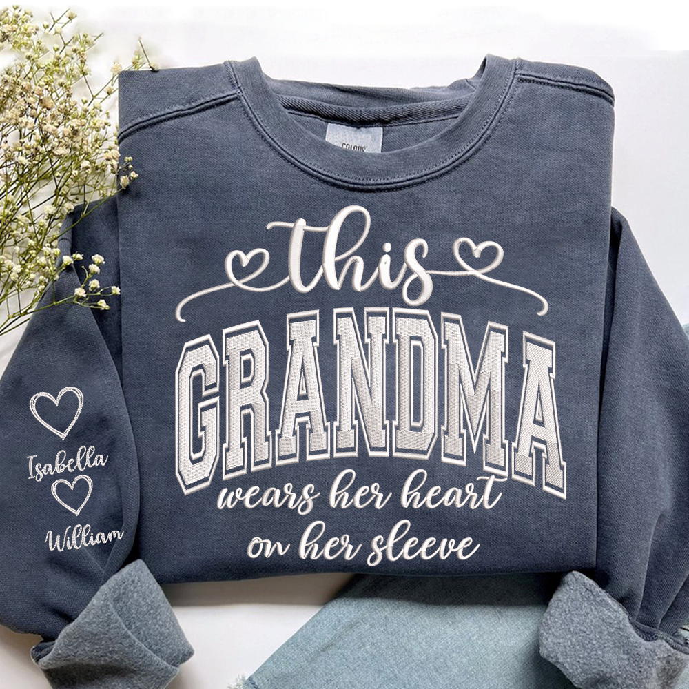 Embroidered This Grandma Wears Her Heart On Her Sleeve Shirt with Grandkids’ Names, Custom Gift for Grandma Sweatshirt