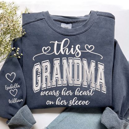 Embroidered This Grandma Wears Her Heart On Her Sleeve Shirt with Grandkids’ Names, Custom Gift for Grandma Sweatshirt