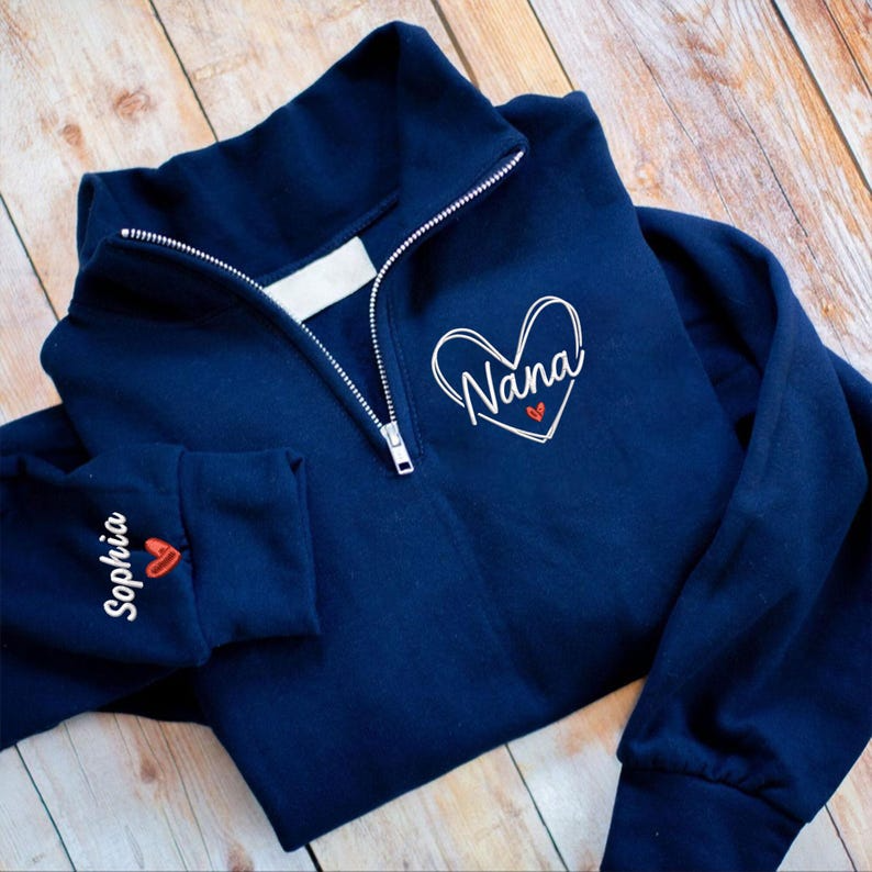 Personalized Nana Quarter Zip Sweatshirt with Heart Design & Custom Grandkids’ Names on Sleeve – Gift for Grandma