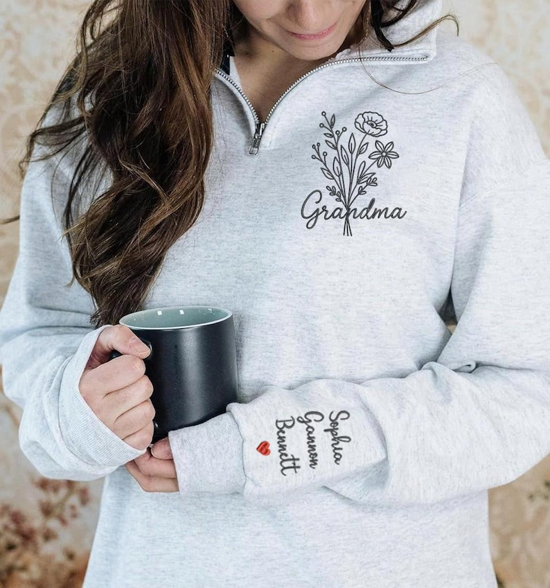 Personalized Grandma Quarter Zip Embroidered Sweatshirt – Custom Grandkids’ Names on Sleeve – Floral Embroidery Gift for Mom, Nana, Mimi