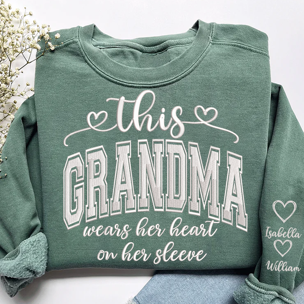 Embroidered This Grandma Wears Her Heart On Her Sleeve Shirt with Grandkids’ Names, Custom Gift for Grandma Sweatshirt