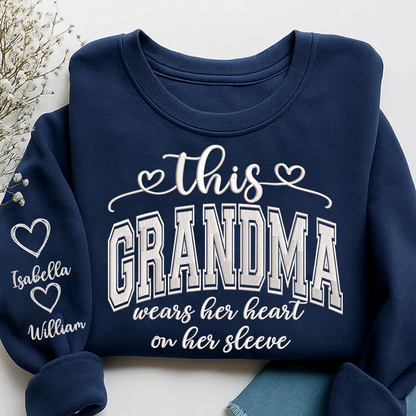 Embroidered This Grandma Wears Her Heart On Her Sleeve Shirt with Grandkids’ Names, Custom Gift for Grandma Sweatshirt