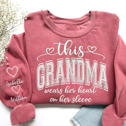 Embroidered This Grandma Wears Her Heart On Her Sleeve Shirt with Grandkids’ Names, Custom Gift for Grandma Sweatshirt