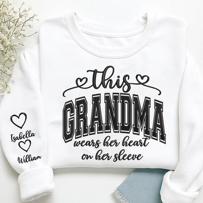 Embroidered This Grandma Wears Her Heart On Her Sleeve Shirt with Grandkids’ Names, Custom Gift for Grandma Sweatshirt